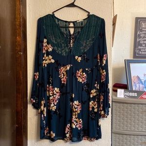 Dress: Emerald green with flower design, lace from and back design